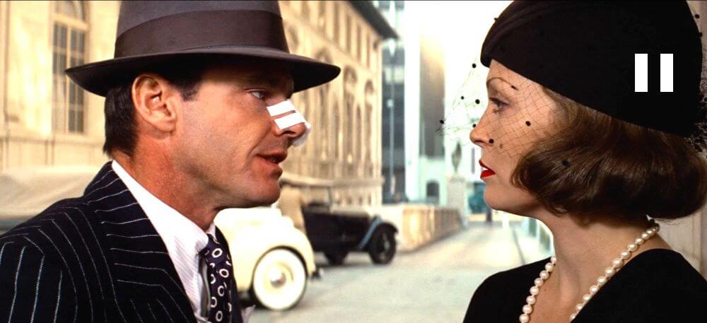 Jake Gittted (Jack Nicholson) and Evelyn Mulwray (Faye Dunaway) in Chinatown 1974 film.