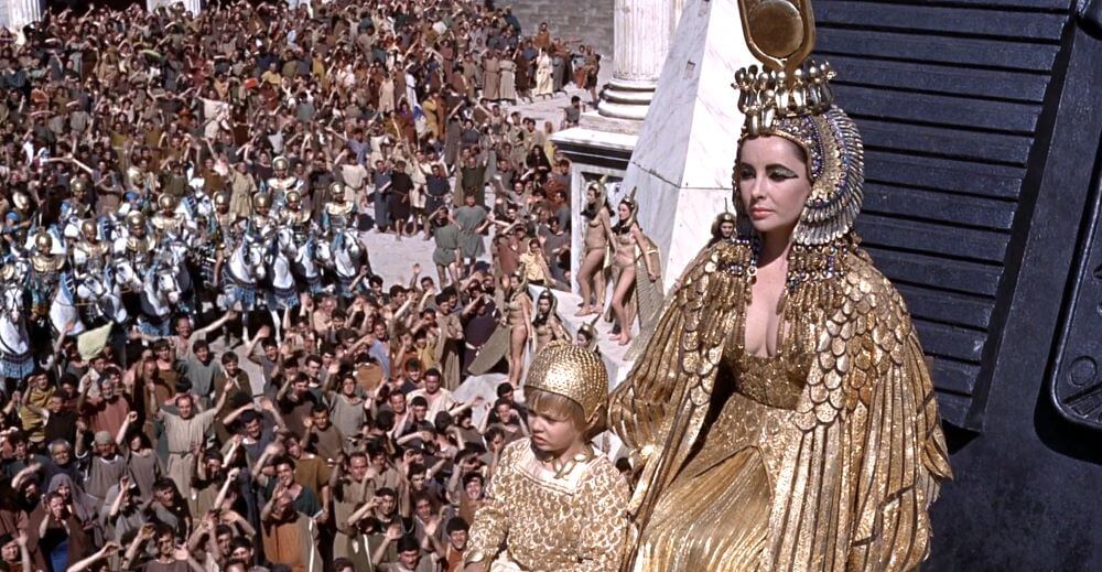 Cleopatra entering Rome with her son Caesarion in a lavish procession and display of Egyptian rich.  Cleopatra was clad in dressed in gold.