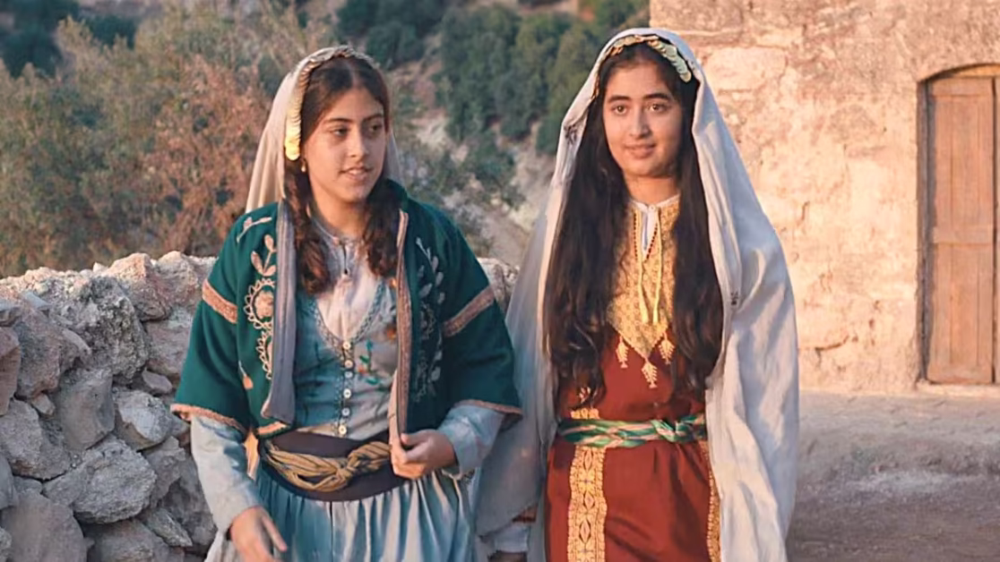 Karam Taher and Tala Gammoh as Farha and Farida in Farha (2021)